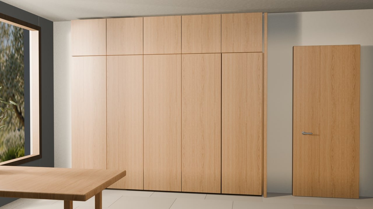 Arredo integrato in rovere in un ambiente a calce